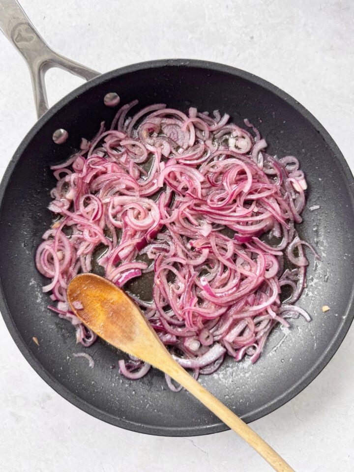 Sautéed red onions in tuna oil.