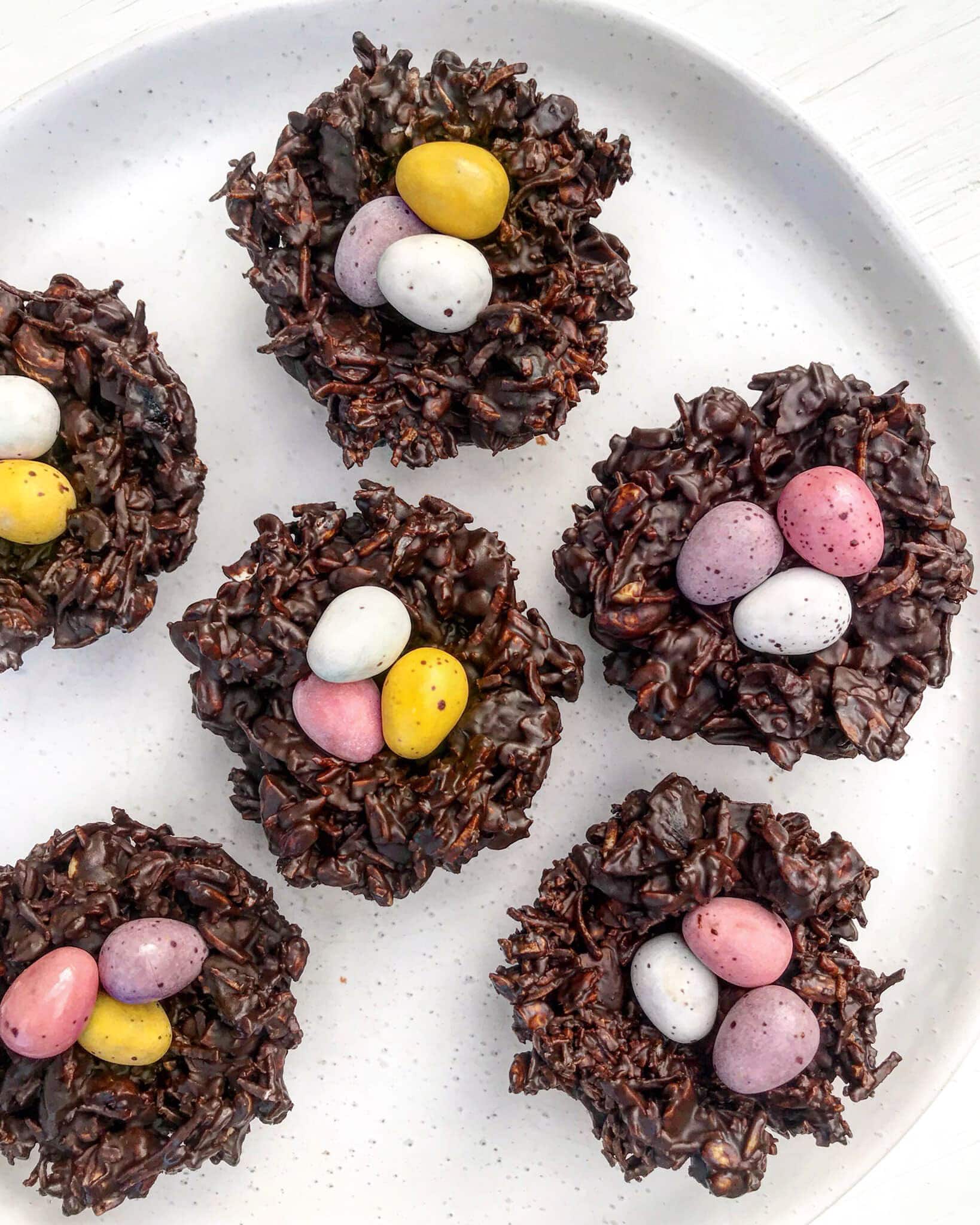 Chocolate easter nest topped with easter eggs.