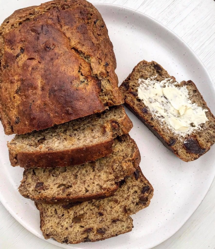 A banana date bread loaf sliced thickly. 