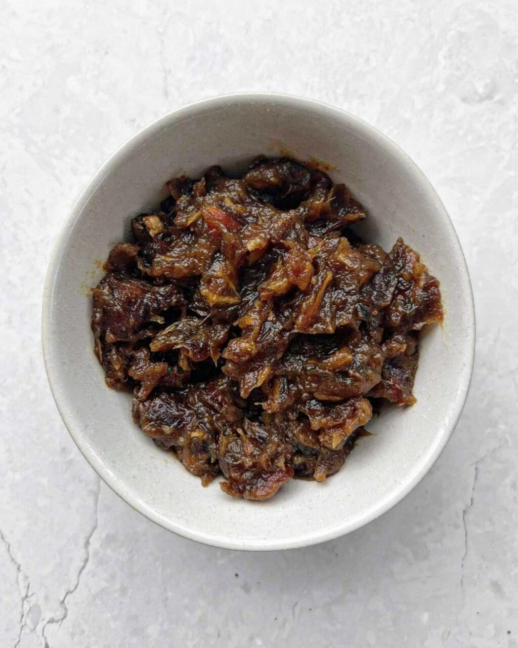 A bowl of date puree. 