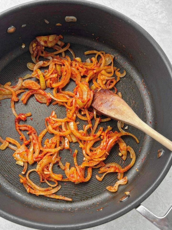 Onions, garlic and tomato paste sautéed in a fry-pan.