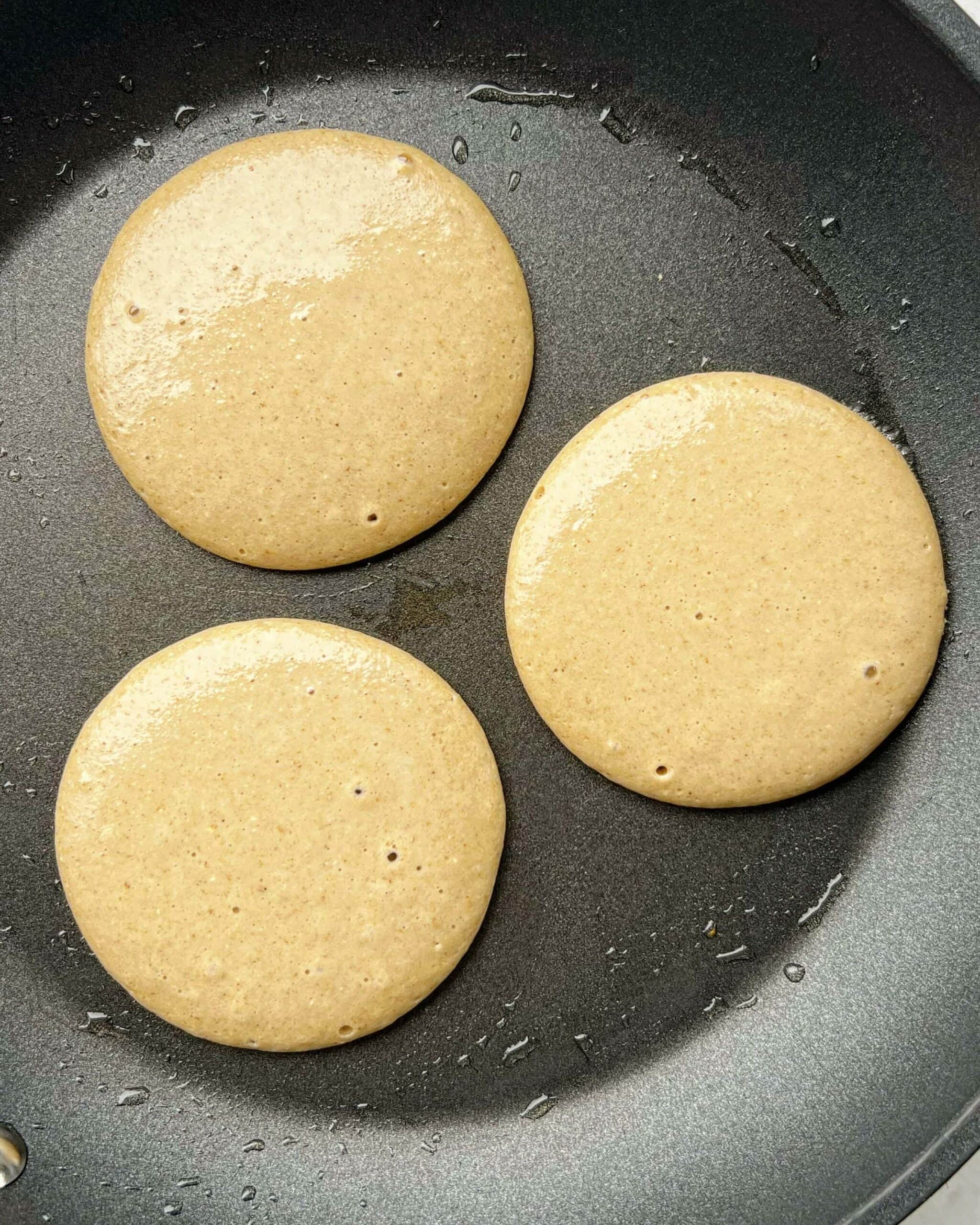 Banana oat pancake batter in a fry pan
