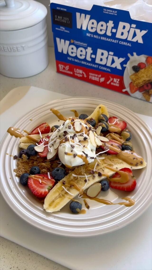 Weet-Bix breakfast banana split🍌 This brekkie idea is quick, easy and fun to make!
 ​
Inspired by the classic banana split dessert, my breakfast rendition may lack ice cream, but it’s still super delicious.​
 ​
I love starting my day with Weet-Bix! Not only is it very high in whole grains, it also provides a source of fibre, and is high in B vitamins and iron.​
 ​
Here’s the recipe: ​
 ​
Ingredients​
1 banana​
1 Weet-Bix biscuit, shredded​
½ cup berries​
⅓ cup low-fat Greek yoghurt​
1 Tbsp peanut butter, loosened with hot water​
Optional toppings to sprinkle: sliced almonds, shredded coconut, cacao nibs…​
A splash of milk, to serve​
 ​
Method​
Slice the banana in half lengthwise and place it in a bowl or on a plate.​
 ​
Sprinkle the shredded Weet-Bix biscuit in the middle of the banana halves. ​
 ​
Arrange the mixed berries on top of the Weet-Bix and banana, and spoon the yoghurt overtop. Drizzle with the nut butter.​
 ​
Add any optional toppings you desire, such as sliced almonds, shredded coconut or cacao nibs.​
 ​
Serve with a splash of milk, if needed. ​@weetbixnz